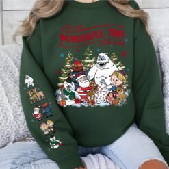 Beige retro Rudolph The Red-Nosed Reindeer Christmas hoodie with sleeve prints, featuring Bumble, Santa, and "The most wonderful time of the year" quote