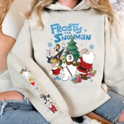 Green retro Frosty The Snowman Christmas sweatshirt with sleeve prints, and beige graphic t-shirt featuring Frosty, Santa, and friends with matching back print