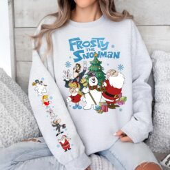 Green retro Frosty The Snowman Christmas sweatshirt with sleeve prints, and beige graphic t-shirt featuring Frosty, Santa, and friends with matching back print