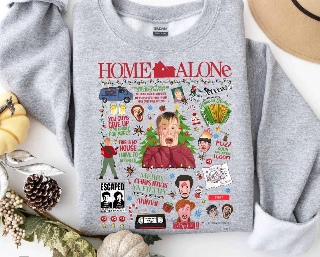 Cream retro Christmas sweatshirt featuring a Home Alone movie collage with Kevin McCallister, the Wet Bandits, and famous quotes like Merry Christmas Ya Filthy Animal