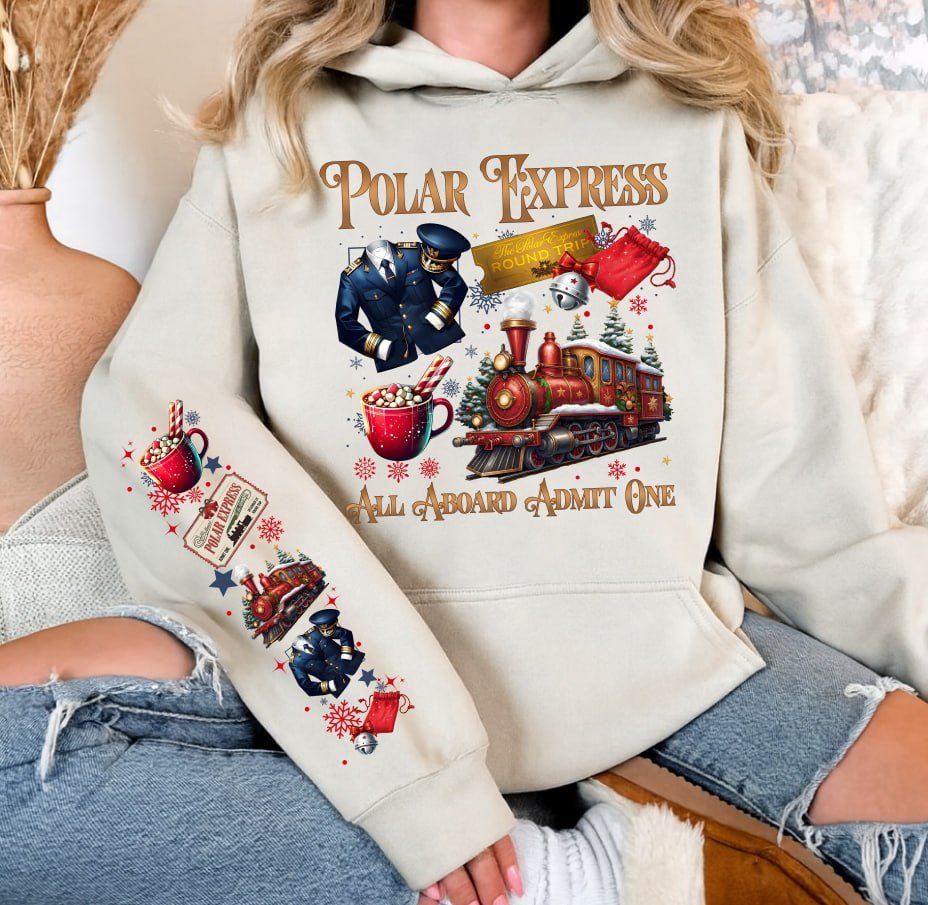 Light grey retro Polar Express Christmas sweatshirt featuring a vintage train, golden ticket, hot cocoa, and matching festive sleeve prints