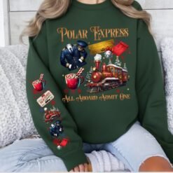 Light grey retro Polar Express Christmas sweatshirt featuring a vintage train, golden ticket, hot cocoa, and matching festive sleeve prints