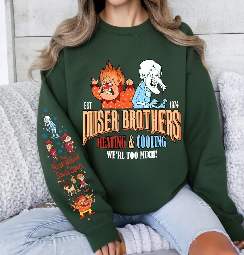 Light grey retro Christmas sweatshirt featuring Heat Miser and Snow Miser, Miser Brothers Heating and Cooling graphic, and character sleeve prints