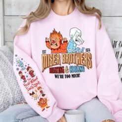 Light grey retro Christmas sweatshirt featuring Heat Miser and Snow Miser, Miser Brothers Heating and Cooling graphic, and character sleeve prints